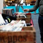 men standing in front of vinyl record sale